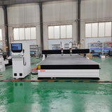 Precision double head CNC router for wood engraving in a workshop, featuring advanced controllers for high accuracy and speed.