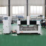 High-precision heavy duty stone CNC router for stone, metal, and wood cutting in an industrial workshop setting.