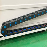 Detail view of heavy-duty stone CNC router cable chain for durable and precise stone processing.