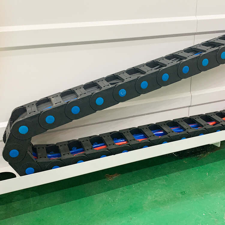 Detail view of heavy-duty stone CNC router cable chain for durable and precise stone processing.