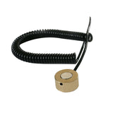 Compact tool sensor with coiled black cable for precision equipment