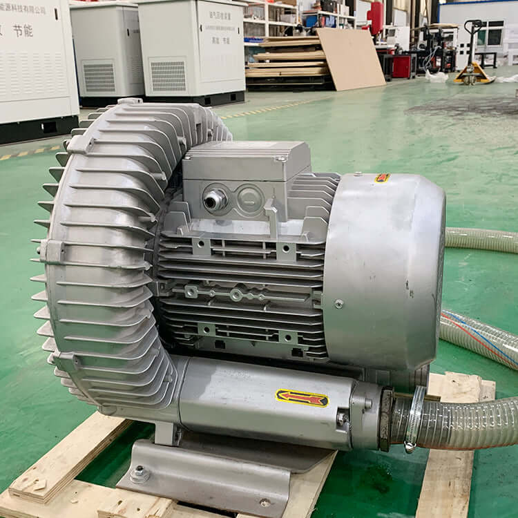 Industrial vacuum pump with coaxial design and bronze impeller for corrosion resistance, shown in a manufacturing facility.