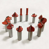 Set of premium red woodworking router bits for precision cutting on a white background.