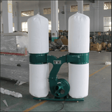 Portable industrial dust collector with dual filters in a workshop setting