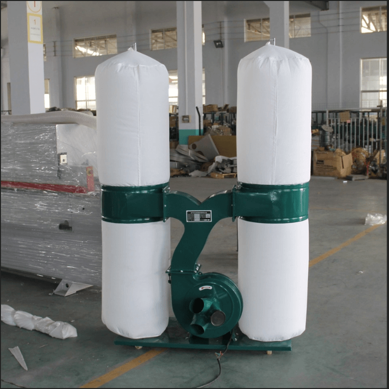 Portable industrial dust collector with dual filters in a workshop setting